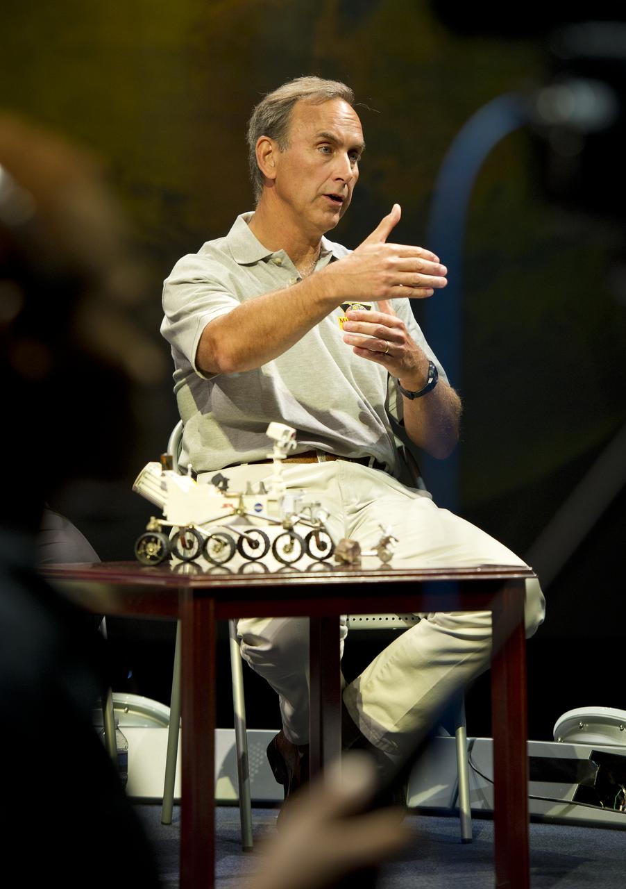 John Grotzinger, Mars Science Laboratory (MSL) project scientist, Jet Propulsion Lab (JPL), Pasadena, Calif., answers a reporter's question at a press conference at the Smithsonian's National Air and Space Museum on Friday, July 22, 2011 in Washington. The MSL is scheduled to launch late this year from NASA's Kennedy Space Center in Florida and land in August 2012. Curiosity is twice as long and more than five times as heavy as previous Mars rovers. The rover will study whether the landing region at Gale crater had favorable environmental conditions for supporting microbial life and for preserving clues about whether life ever existed. Photo Credit: (NASA/Carla Cioffi)