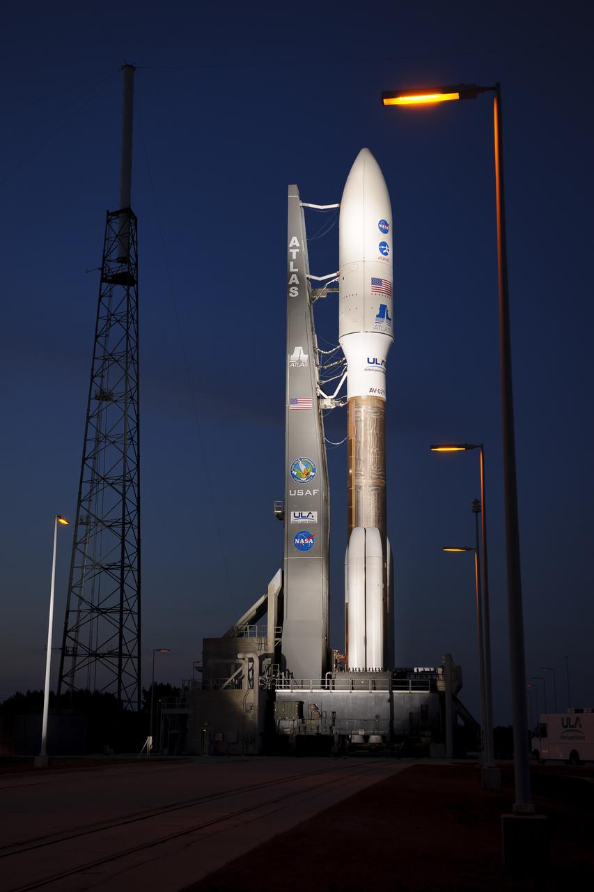 An Atlas V rocket with NASA's Juno spacecraft payload is seen the evening before it's planned launch at Space Launch Complex 41 of the Cape Canaveral Air Force Station in Florida on Thursday, August 4, 2011. The Juno spacecraft will make a five-year, 400-million-mile voyage to Jupiter, orbit the planet, investigate its origin and evolution with eight instruments to probe its internal structure and gravity field, measure water and ammonia in its atmosphere, map its powerful magnetic field and observe its intense auroras. Photo Credit: (NASA/Bill Ingalls)