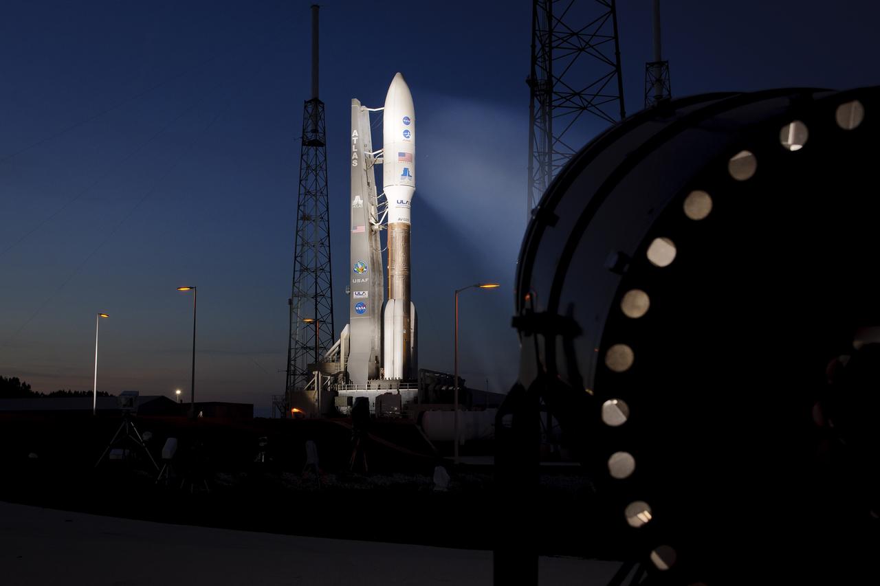 An Atlas V rocket with NASA's Juno spacecraft payload is seen the evening before it's planned launch at Space Launch Complex 41 of the Cape Canaveral Air Force Station in Florida on Thursday, August 4, 2011. The Juno spacecraft will make a five-year, 400-million-mile voyage to Jupiter, orbit the planet, investigate its origin and evolution with eight instruments to probe its internal structure and gravity field, measure water and ammonia in its atmosphere, map its powerful magnetic field and observe its intense auroras. Photo Credit: (NASA/Bill Ingalls)
