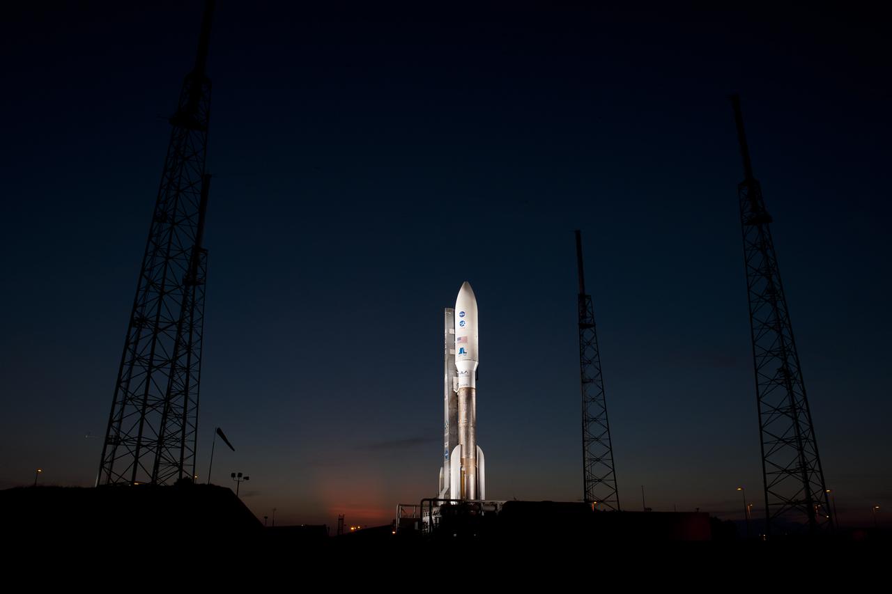 An Atlas V rocket with NASA's Juno spacecraft payload is seen the evening before it's planned launch at Space Launch Complex 41 of the Cape Canaveral Air Force Station in Florida on Thursday, August 4, 2011. The Juno spacecraft will make a five-year, 400-million-mile voyage to Jupiter, orbit the planet, investigate its origin and evolution with eight instruments to probe its internal structure and gravity field, measure water and ammonia in its atmosphere, map its powerful magnetic field and observe its intense auroras. Photo Credit: (NASA/Bill Ingalls)