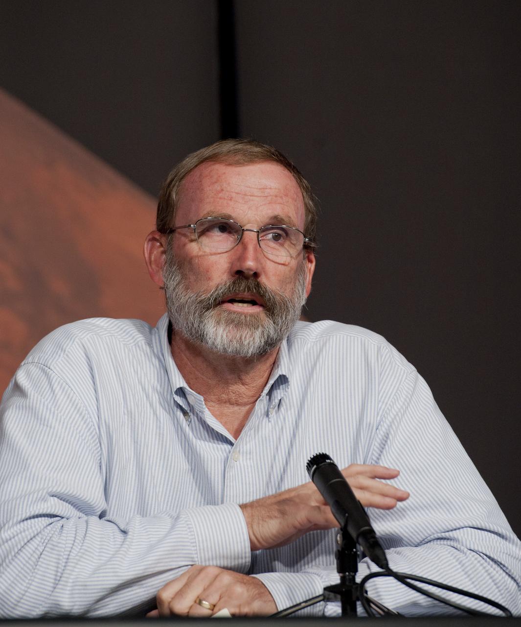 Philip Christensen, a geophysicist at Arizona State University, speaks during a briefing, Thursday, Aug. 4, 2011, at NASA Headquarters in Washington. Observations from NASA's Mars Reconnaissance Orbiter (MRO) have revealed possible flowing water during the warmest months on Mars. Dark, finger-like features appear and extend down some Martian slopes during late spring through summer, fade in winter, and return during the next spring. Repeated observations have tracked the seasonal changes in these recurring features on several steep slopes in the middle latitudes of Mars' southern hemisphere. Photo Credit: (NASA/Paul E. Alers)