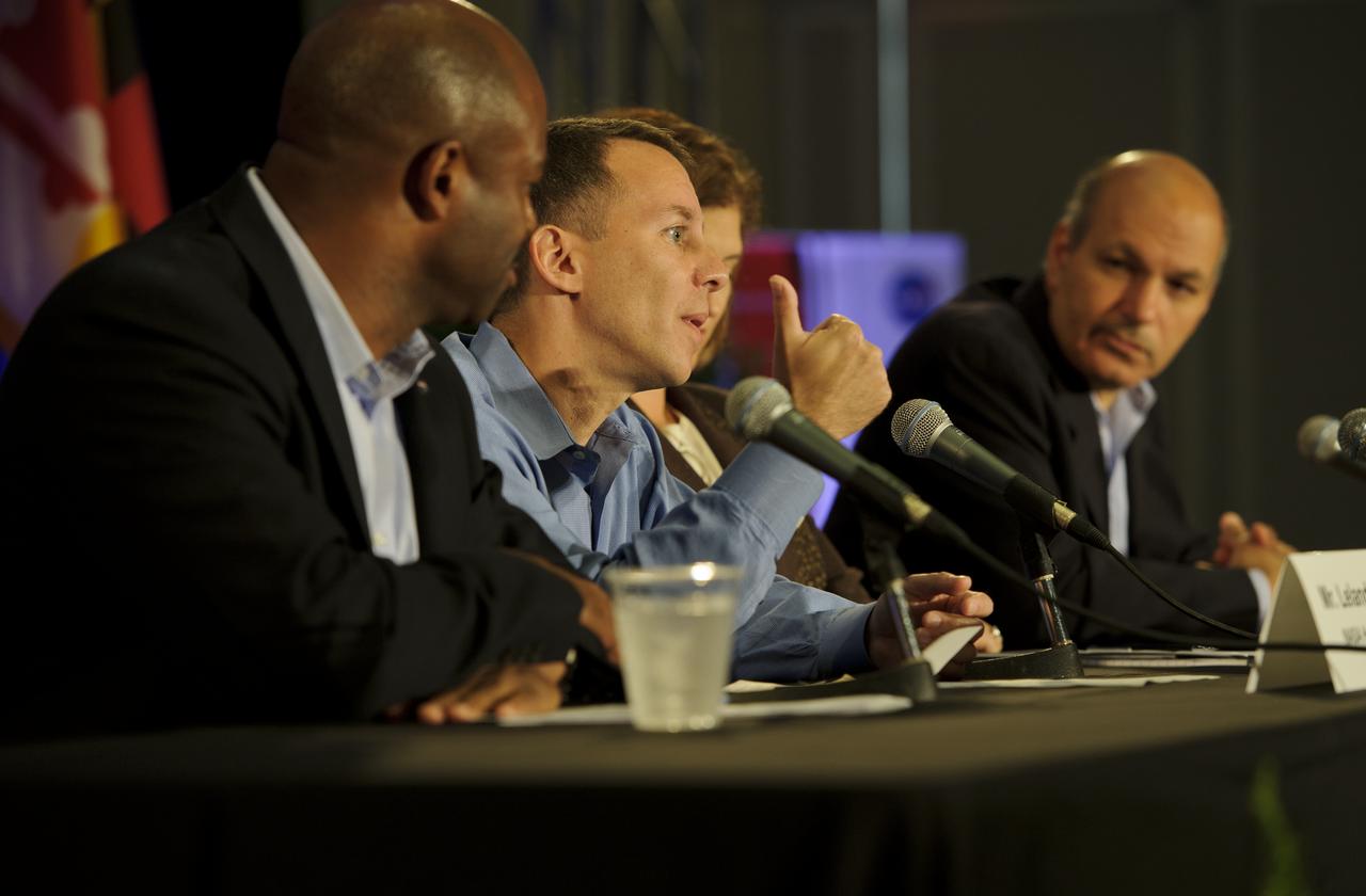Dr. Robert Braun, NASA Chief Technologist, second from left, makes a point, as panelists Leland Melvin, Assoicate Administrator for NASA Education, left, Dr. Laurie Leshin, NASA Deputy Associate Administrator Exploration Systems Mission Directortorate, and Dr. Waleed Abdalati, NASA Chief Scientist, right, look on during a panel discussion at the NASA Future Forum held at the Riggs Alumni Center on the campus of the University of Maryland, Thursday, Aug. 11, 2011 in College Park, Md. Photo Credit: (NASA/Paul E. Alers)