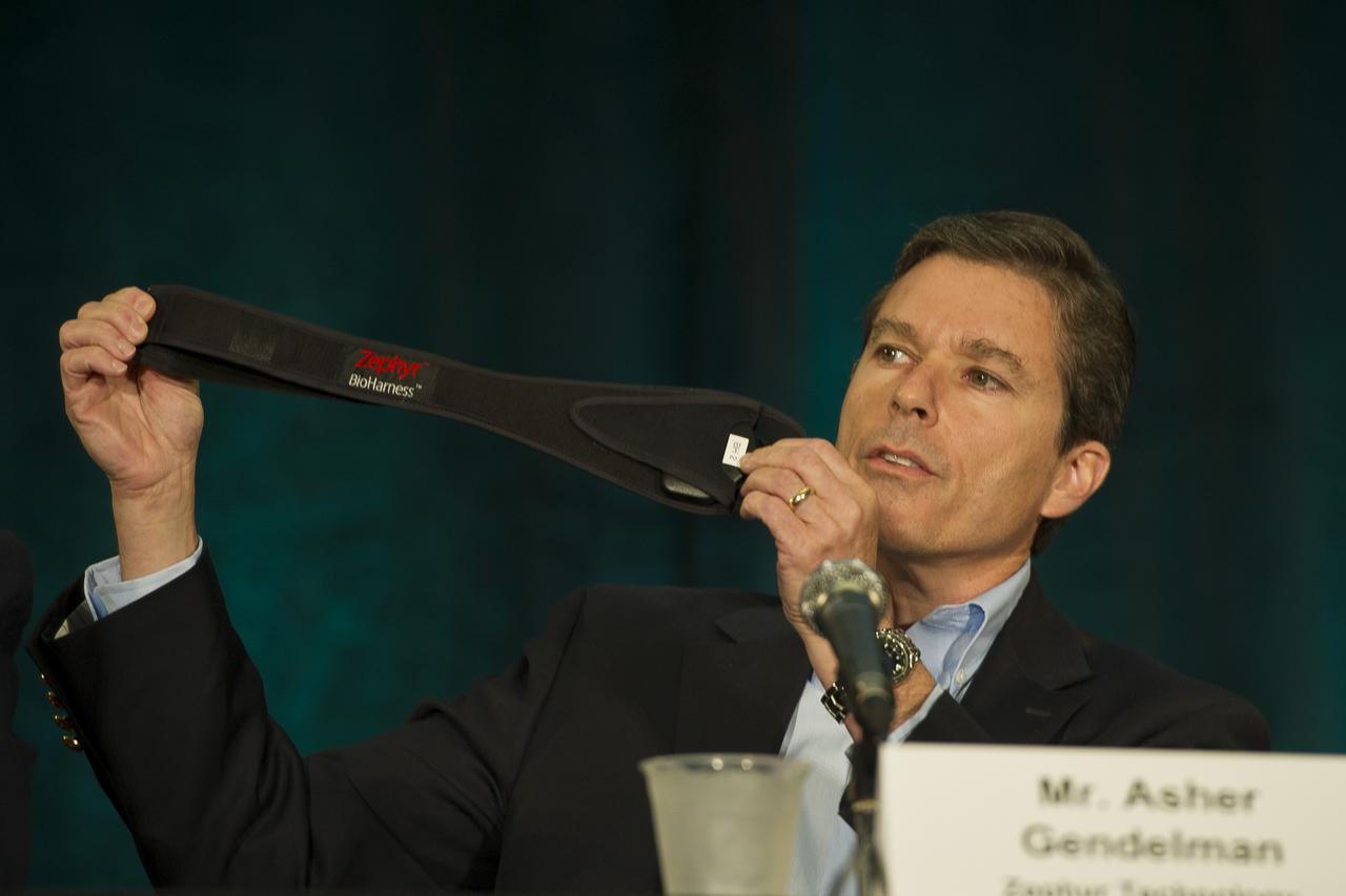 Asher Gendelman, a director of technology at Zephyr Technology, holds up chest belt as he speaks about technology investments and their benefits during a panel discussion at the 2011 NASA Future Forum held at the Riggs Alumni Center on the campus of the University of Maryland, Thursday, Aug. 11, 2011, in College Park, Md. Photo Credit: (NASA/Paul E. Alers)