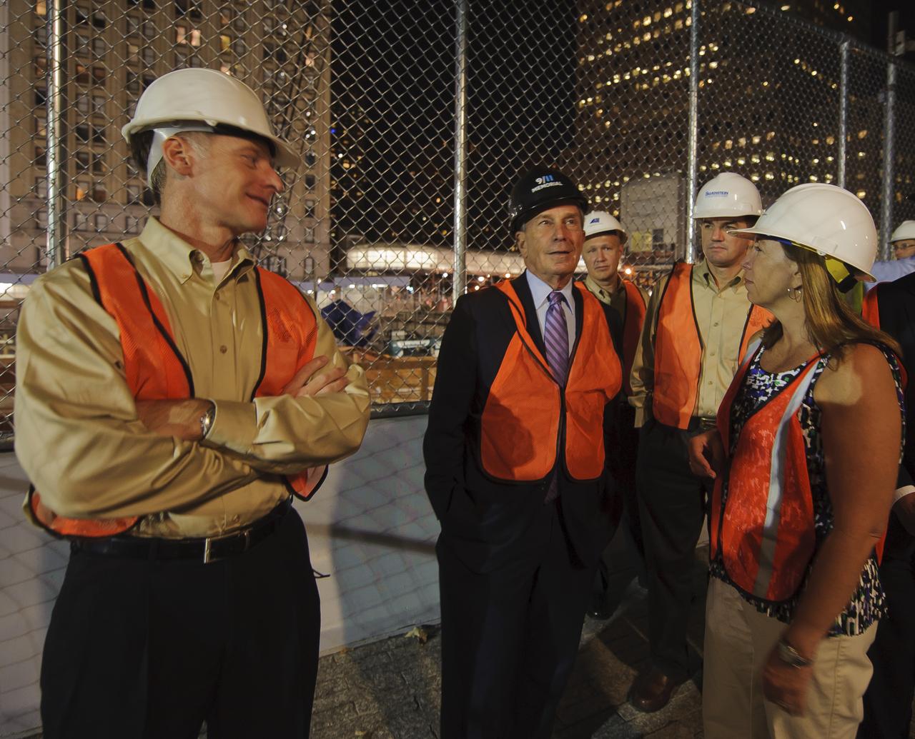 New York Mayor Michael Bloomberg, center, talks about the construction around the site where the World Trade Center once stood to NASA Deputy Administrator Lori Garver, right, and members of the STS-135 crew including commander Chris Ferguson, left, mission specialist Rex Walheim, second right, and pilot Doug Hurley, rear, as they tour the area, Wednesday evening, Aug. 18, 2011, in New York.  Photo Credit: (NASA/Paul E. Alers)