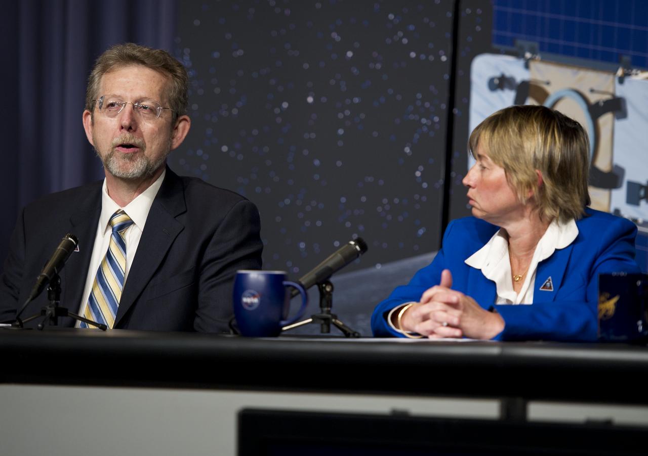 Jim Green (left), director, Planetary Science Division at NASA Headquarters, speaks at a press conference about the upcoming launch to the moon of the Gravity Recovery and Interior Laboratory (GRAIL) mission, Thursday, Aug. 25, 2011 in Washington.  GRAIL's primary science objectives are to determine the structure of the lunar interior, from crust to core, and to advance understanding of the thermal evolution of the moon.  The mission will place two spacecraft into the same orbit around the moon which will gather information about the its gravitational field enabling scientists to create a high-resolution map.  Photo Credit:  (NASA/Carla Cioffi)