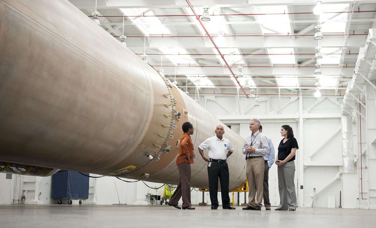 NASA Administrator Charles Bolden, second from left, talks with United Launch Alliance Vice President of Mission operations Jim Sponnick, along with NASA Mission Manager for Launch Services Wanda Harding, left, White House Fellow Debra Kurshan, right, and NASA Senior Advisor Mike French, background, in front of the United Launch Alliance Atlas V first stage booster, Wednesday, Sept. 7, 2011, at the Cape Canaveral Air Force Station in Cape Canaveral, Fla. The booster will help send NASA's Mars Science Laboratory Curiosity rover to Mars later this year. Photo Credit: (NASA/Bill Ingalls)