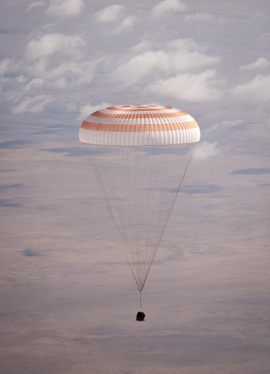 The Soyuz TMA-21 spacecraft is seen as it lands with Expedition 28 Commander Andrey Borisenko, and Flight Engineers Ron Garan, and Alexander Samokutyaev in a remote area outside of the town of Zhezkazgan, Kazakhstan, on Friday, Sept. 16, 2011. NASA Astronaut Garan, Russian Cosmonauts Borisenko and Samokutyaev are returning from more than five months onboard the International Space Station where they served as members of the Expedition 27 and 28 crews. Photo Credit: (NASA/Bill Ingalls)