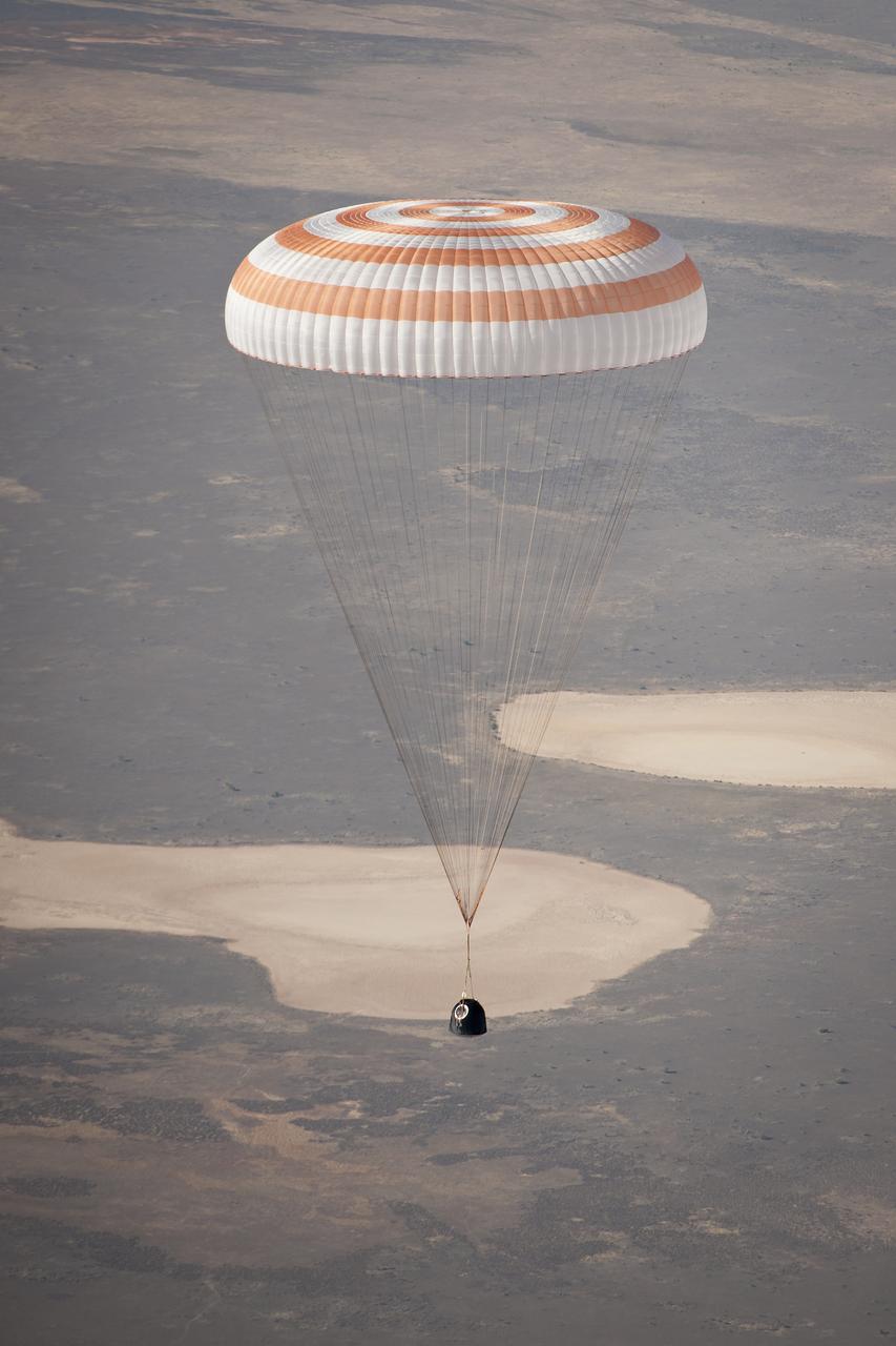 The Soyuz TMA-21 spacecraft is seen as it lands with Expedition 28 Commander Andrey Borisenko, and Flight Engineers Ron Garan, and Alexander Samokutyaev in a remote area outside of the town of Zhezkazgan, Kazakhstan, on Friday, Sept. 16, 2011. NASA Astronaut Garan, Russian Cosmonauts Borisenko and Samokutyaev are returning from more than five months onboard the International Space Station where they served as members of the Expedition 27 and 28 crews. Photo Credit: (NASA/Bill Ingalls)