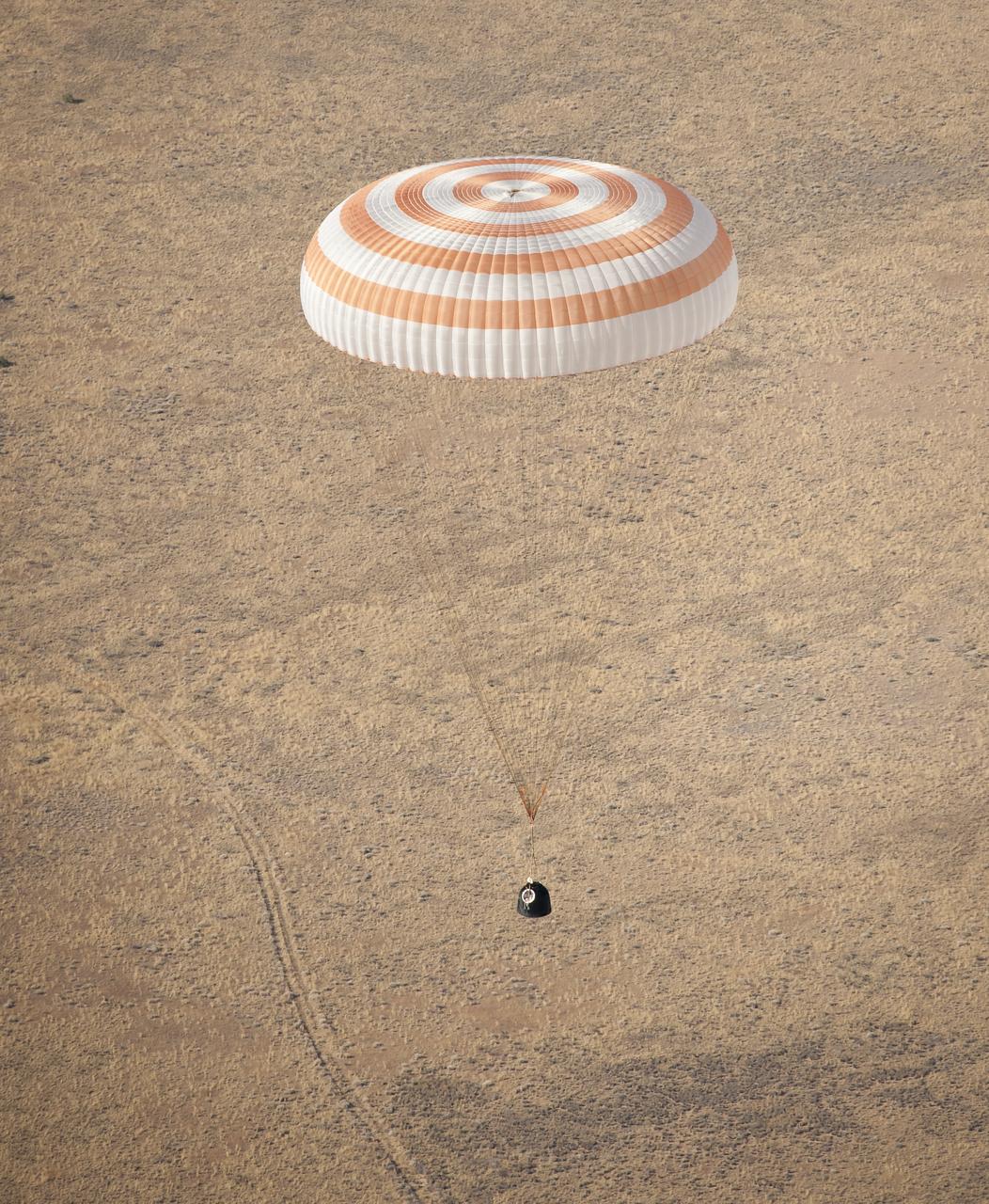 The Soyuz TMA-21 spacecraft is seen as it lands with Expedition 28 Commander Andrey Borisenko, and Flight Engineers Ron Garan, and Alexander Samokutyaev in a remote area outside of the town of Zhezkazgan, Kazakhstan, on Friday, Sept. 16, 2011. NASA Astronaut Garan, Russian Cosmonauts Borisenko and Samokutyaev are returning from more than five months onboard the International Space Station where they served as members of the Expedition 27 and 28 crews. Photo Credit: (NASA/Bill Ingalls)