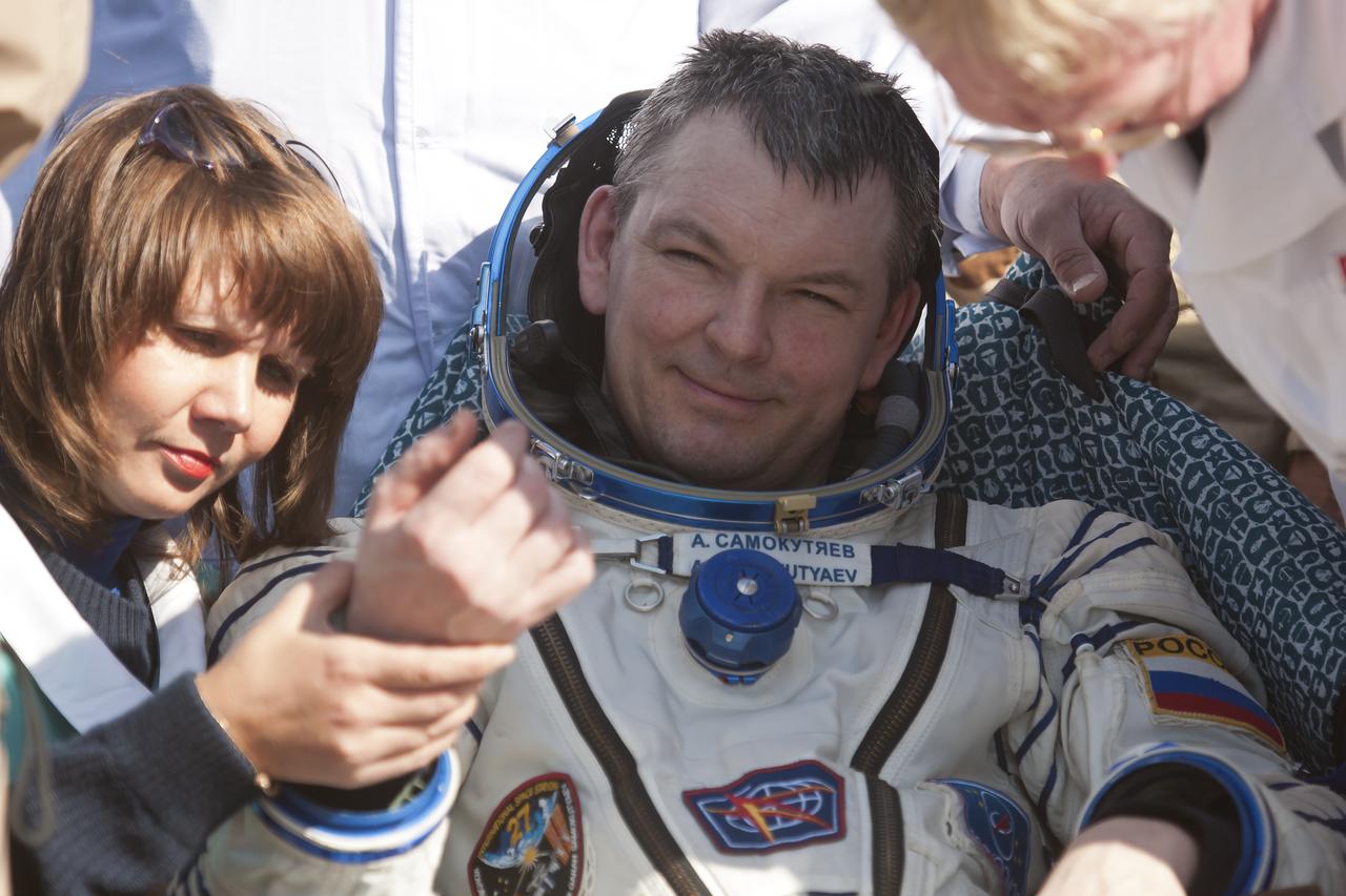 Expedition 28 Flight Engineer Alexander Samokutyaev is given a routine medical check outside the Soyuz TMA-21 Capsule just minutes after he and Expedition 28 Commander Andrey Borisenko, and Flight Engineer Ron Garan landed in a remote area outside the town of Zhezkazgan, Kazakhstan, on Friday, Sept. 16, 2011. NASA Astronaut Garan, Russian Cosmonauts Borisenko and Samokutyaev are returning from more than five months onboard the International Space Station where they served as members of the Expedition 27 and 28 crews. Photo Credit: (NASA/Bill Ingalls)