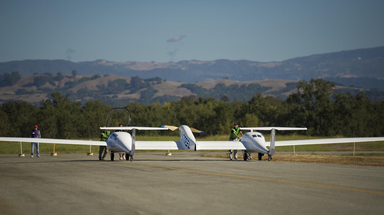 The Pipistrel-USA Taurus G4 aircraft is pushed back to the weigh-in hangar as they start the day's 2011 Green Flight Challenge competition, sponsored by Google, at the Charles M. Schulz Sonoma County Airport in Santa Rosa, Calif. on Monday, Sept. 26, 2011. NASA and the Comparative Aircraft Flight Efficiency (CAFE) Foundation are having the challenge with the goal to advance technologies in fuel efficiency and reduced emissions with cleaner renewable fuels and electric aircraft. Photo Credit: (NASA/Bill Ingalls)