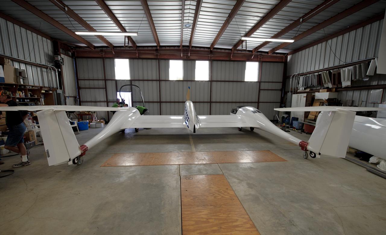 The Pipistrel-USA, Taurus G4 aircraft is prepared to be rolled out of the weigh-in hangar during the 2011 Green Flight Challenge, sponsored by Google, at the Charles M. Schulz Sonoma County Airport in Santa Rosa, Calif. on Monday, Sept. 26, 2011.  NASA and the Comparative Aircraft Flight Efficiency (CAFE) Foundation are having the challenge with the goal to advance technologies in fuel efficiency and reduced emissions with cleaner renewable fuels and electric aircraft. Photo Credit: (NASA/Bill Ingalls)