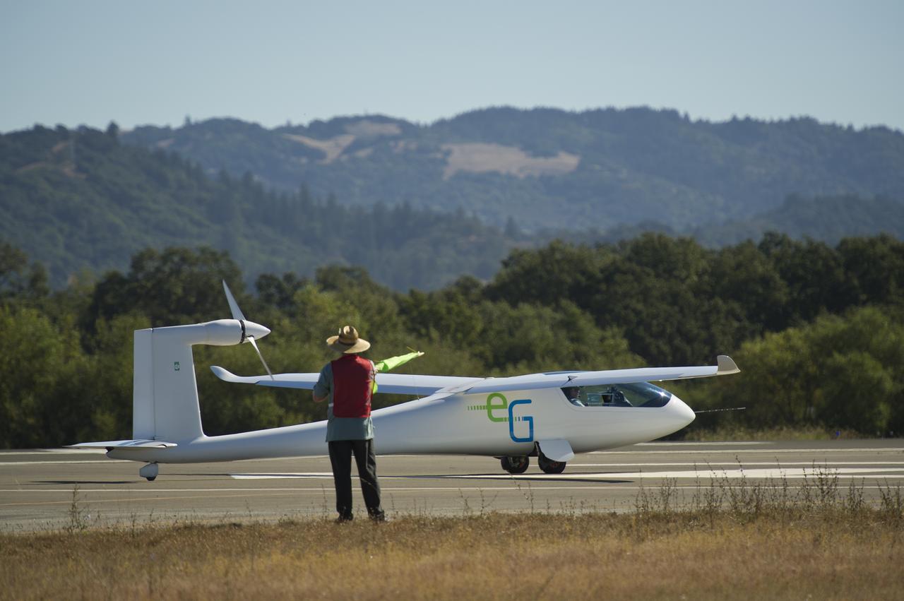 The e-Genius aircraft prepares to takeoff for the miles per gallon (MPG) flight during the 2011 Green Flight Challenge, sponsored by Google, at the Charles M. Schulz Sonoma County Airport in Santa Rosa, Calif. on Tuesday, Sept. 27, 2011.  NASA and the Comparative Aircraft Flight Efficiency (CAFE) Foundation are having the challenge with the goal to advance technologies in fuel efficiency and reduced emissions with cleaner renewable fuels and electric aircraft. Photo Credit: (NASA/Bill Ingalls)