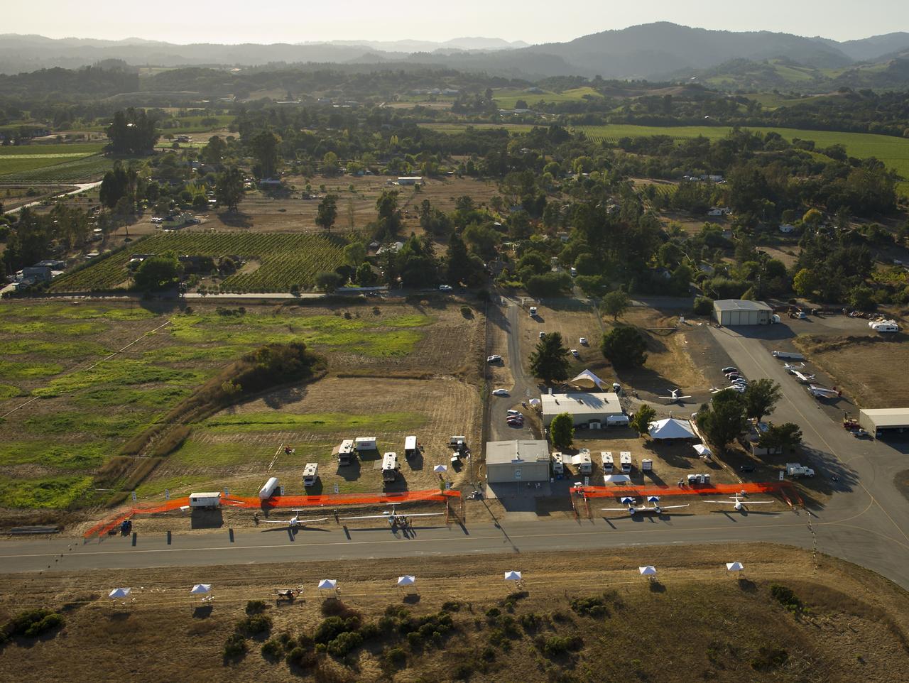 The campus of the 2011 Green Flight Challenge, sponsored by Google, is seen in this aerial view at the Charles M. Schulz Sonoma County Airport in Santa Rosa, Calif. on Wednesday, Sept. 28, 2011. NASA and the Comparative Aircraft Flight Efficiency (CAFE) Foundation are having the challenge with the goal to advance technologies in fuel efficiency and reduced emissions with cleaner renewable fuels and electric aircraft. Photo Credit: (NASA/Bill Ingalls)