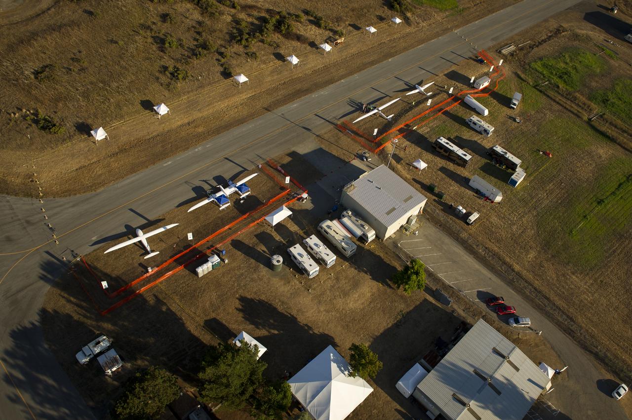 The e-Genius, left, Taurus G4, 2nd from left, EcoEagle, and PhoEnix aircraft, top right, are seen on the campus of the 2011 Green Flight Challenge, sponsored by Google, at the Charles M. Schulz Sonoma County Airport in Santa Rosa, Calif. on Wednesday, Sept. 28, 2011. NASA and the Comparative Aircraft Flight Efficiency (CAFE) Foundation are having the challenge with the goal to advance technologies in fuel efficiency and reduced emissions with cleaner renewable fuels and electric aircraft. Photo Credit: (NASA/Bill Ingalls)