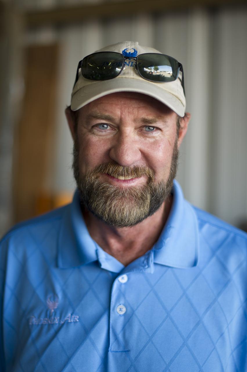 PhoEnix Aircraft Pilot Jim Lee poses for a photograph during the 2011 Green Flight Challenge, sponsored by Google, held at the Charles M. Schulz Sonoma County Airport in Santa Rosa, Calif. on Thursday, Sept. 29, 2011. NASA and the Comparative Aircraft Flight Efficiency (CAFE) Foundation are having the challenge with the goal to advance technologies in fuel efficiency and reduced emissions with cleaner renewable fuels and electric aircraft. Photo Credit: (NASA/Bill Ingalls)