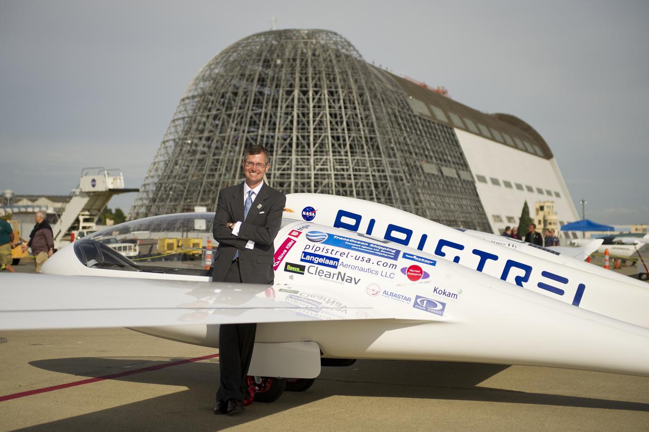 Team Lead Jack Langelaan poses for a photograph next to the Pipistrel-USA, Taurus G4, aircraft prior to winning the 2011 Green Flight Challenge, sponsored by Google, on Monday, Oct. 3, 2011 at the NASA Ames Research Center, Mountain View, Calif.  The all electric Taurus G4 aircraft achieved the equivalency of more than 400 miles per gallon.  NASA and CAFE held the challenge to advance technologies in fuel efficiency and reduced emissions with cleaner renewable fuels and electric aircraft. Photo Credit: (NASA/Bill Ingalls)
