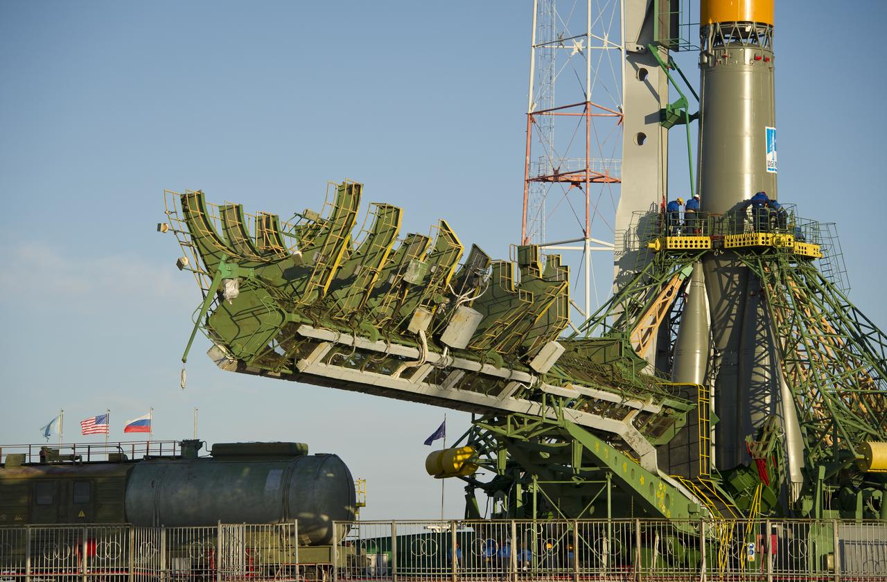 A large gantry mechanism is prepared for installation around the Soyuz TMA-22 spacecraft on Friday, Nov. 11, 2011 at the Baikonur Cosmodrome in Kazakhstan. The Soyuz will launch November 14 to send the Expedition 29 crew to the International Space Station. Photo Credit: (NASA/Carla Cioffi)