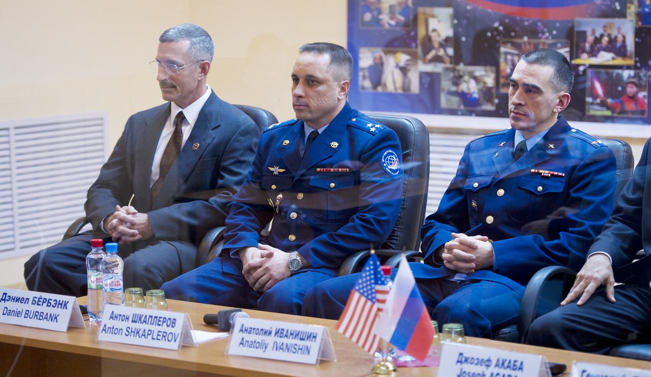Expedition 29 crew members NASA Flight Engineer Daniel Burbank, far left, Russian Soyuz Commander Anton Shkaplerov, center, and Russian Flight Engineer Anatoly Ivanishin are seen the State Commission meeting to approve the Soyuz launch of Expedition 29 to the International Space Station in Baikonur, Kazakhstan on Saturday, Nov. 12, 2011.  Photo Credit: (NASA/Carla Cioffi)