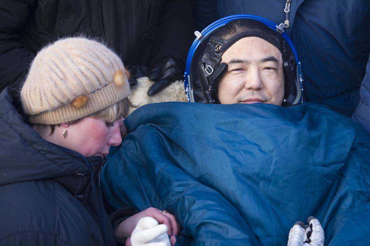 Expedition 29 Flight Engineer, JAXA (Japan Aerospace Exploration Agency) Astronaut, Satoshi Furukawa smiles as he rest in a chair outside the Soyuz TMA-02M Capsule just minutes after he and Expedition 29 Commander Mike Fossum and Flight Engineer Sergei Volkov landed in a remote area outside of the town of Arkalyk, Kazakhstan, on Tuesday, Nov. 22, 2011. NASA Astronaut Fossum, Russian Cosmonaut Volkov and JAXA (Japan Aerospace Exploration Agency) Astronaut Furukawa are returning from more than five months onboard the International Space Station where they served as members of the Expedition 28 and 29 crews. Photo Credit: (NASA/Bill Ingalls)