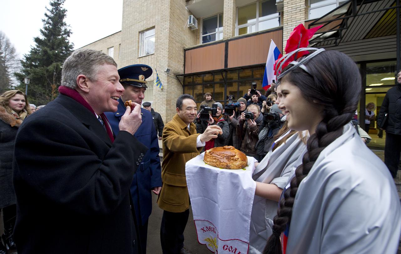 Expedition 29 Commander Mike Fossum, left, Russian cosmonaut Sergei Volkov and Japanese Aerospace Exploration Agency astronaut Satoshi Furukawa, third from left, take part in a traditional welcome home ceremony at the Gagarin Cosmonaut Training Center in Star City, Russia on Thursday, Dec. 15, 2011.  The crew landed on the steppes of Kazakhstan on November 22nd after spending five months living and working aboard the International Space Station.  Photo Credit:  (NASA/Carla Cioffi)