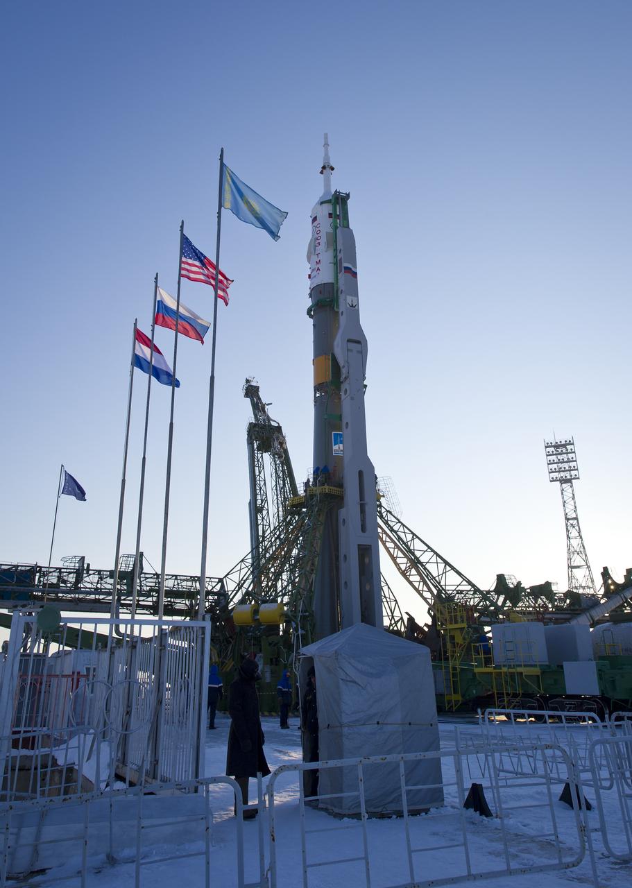 The flags representing Kazakhstan and the nations of the three crewmembers who will launch in the Soyuz TMA-03M spacecraft are shown at the launch pad at the Baikonur Cosmodrome in Kazakhstan on Monday, Dec. 19, 2011.   From left to right are the flags of The Netherlands, Russia, the United States and Kazakhstan.  Scheduled to launch on December 21st local time are Expedition 30 Soyuz Commander Oleg Kononenko of Russia, NASA Flight Engineer Don Pettit and ESA (European Space Agency) astronaut and Flight Engineer Andre Kuipers. Photo Credit (NASA/Carla Cioffi)