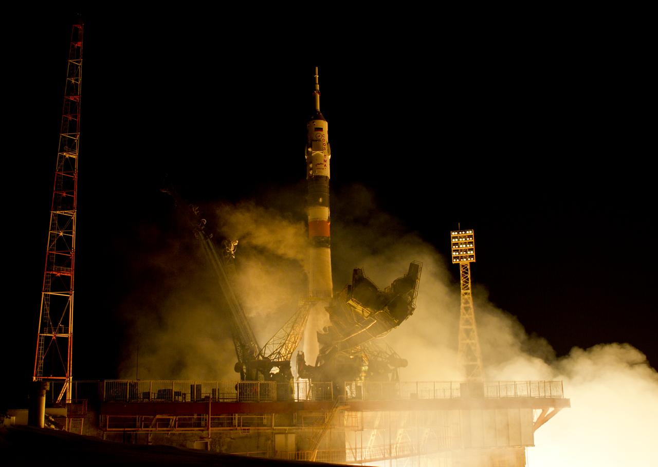 The Soyuz TMA-03M rocket launches from the Baikonur Cosmodrome in Kazakhstan on Wednesday, Dec. 21, 2011 carrying Expedition 30 Soyuz Commander Oleg Kononenko of Russia, NASA Flight Engineer Don Pettit and ESA (European Space Agency) astronaut and Flight Engineer Andre Kuipers to the International Space Station. (Photo Credit: NASA/Carla Cioffi)