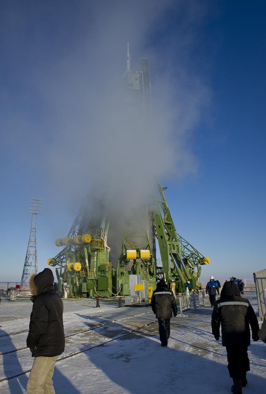 The Soyuz TMA-03M spacecraft is obscured by the venting of liquid oxygen on it's launch pad at the Baikonur Cosmodrome in Kazakhstan, Wednesday, Dec. 21, 2011 just hours before its launch to send the crew of Expedition  30 NASA Flight Engineer Don Pettit, Soyuz Commander Oleg Konenko, ESA (European Space Agency Andre Kuipers to the International Space Station.  Photo Credit:  (NASA/Carla Cioffi)