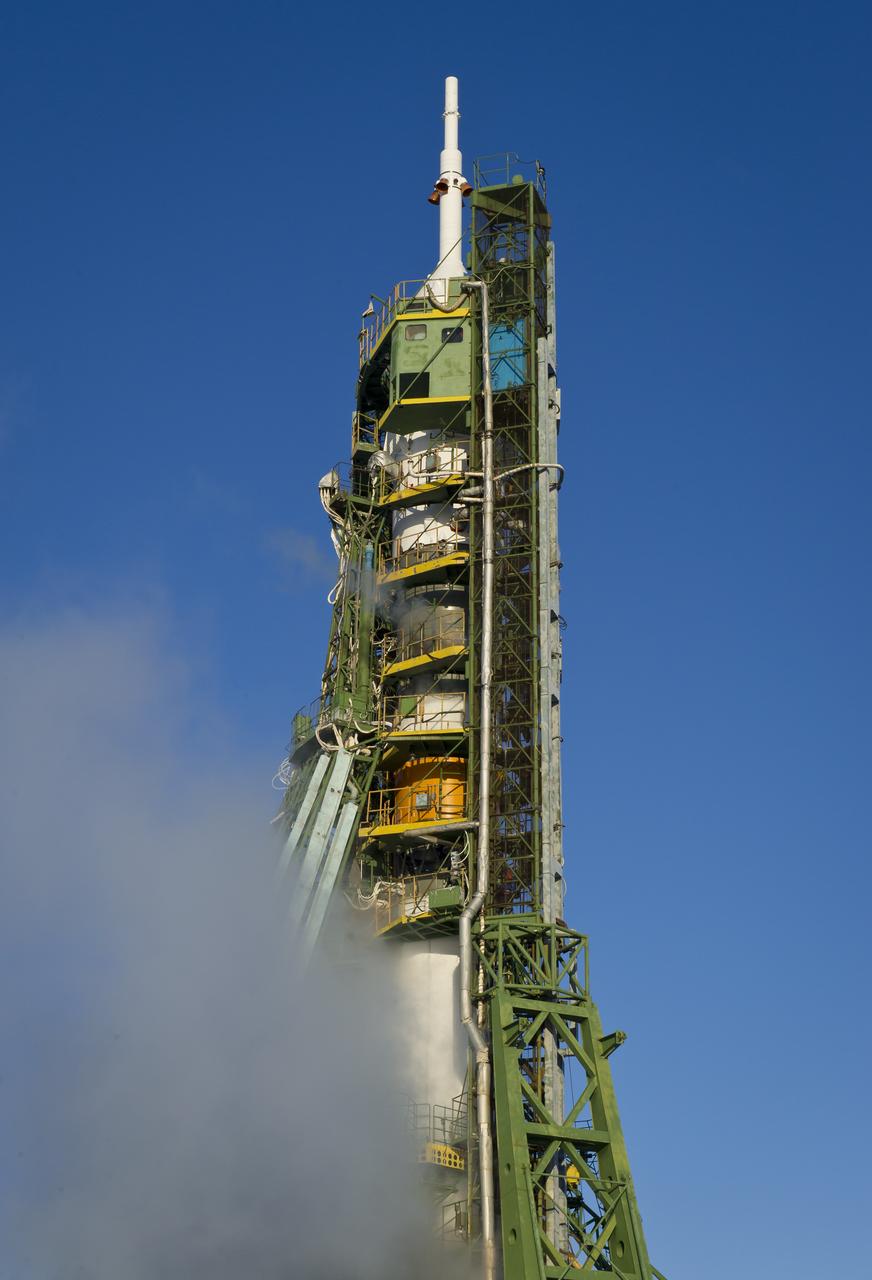 The Soyuz TMA-03M spacecraft is obscured by the venting of liquid oxygen on it's launch pad at the Baikonur Cosmodrome in Kazakhstan, Wednesday, Dec. 21, 2011 just hours before its launch to send the crew of Expedition  30 NASA Flight Engineer Don Pettit, Soyuz Commander Oleg Konenko, ESA (European Space Agency Andre Kuipers to the International Space Station.  Photo Credit:  (NASA/Carla Cioffi)