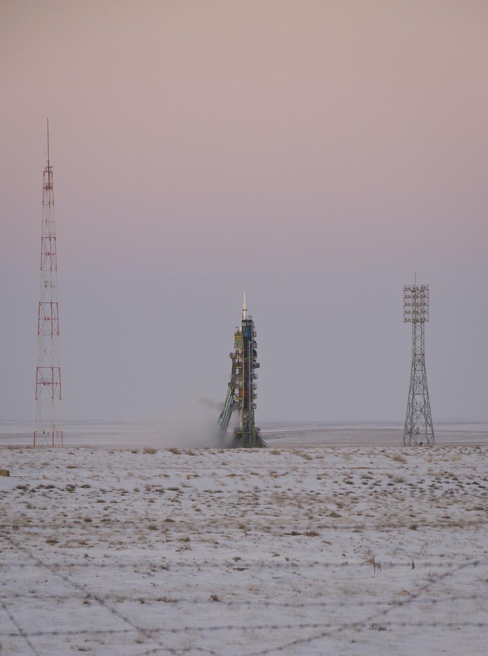 The Soyuz TMA-03M spacecraft is seen at dusk an hour before launch at the Baikonur Cosmodrome in Kazakhstan, Wednesday, Dec. 21, 2011.  The crew of Expedition 30, NASA Flight Engineer Don Pettit, Soyuz Commander Oleg Konenko, ESA (European Space Agency) Andre Kuipers launched at 7:16pm local time to the International Space Station.  Photo Credit:  (NASA/Carla Cioffi)