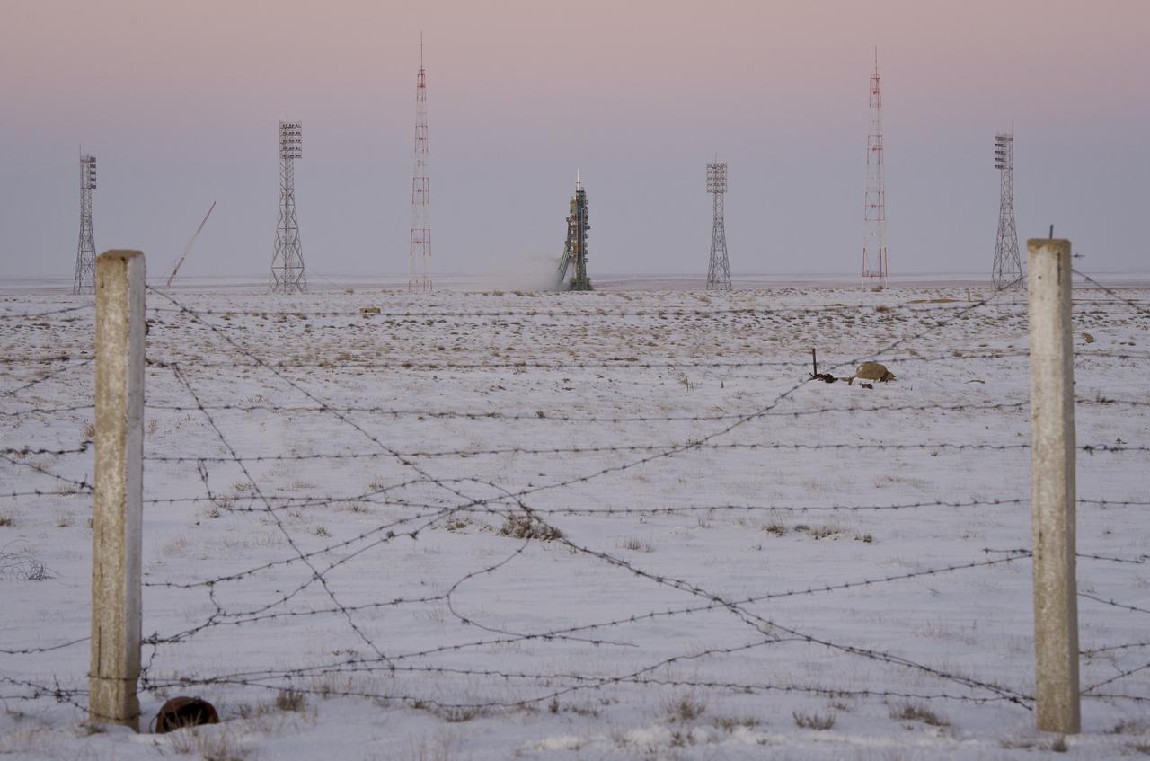 The Soyuz TMA-03M spacecraft is seen at dusk an hour before launch at the Baikonur Cosmodrome in Kazakhstan, Wednesday, Dec. 21, 2011.  The crew of Expedition 30, NASA Flight Engineer Don Pettit, Soyuz Commander Oleg Konenko, ESA (European Space Agency) Andre Kuipers launched at 7:16pm local time to the International Space Station.  Photo Credit:  (NASA/Carla Cioffi)