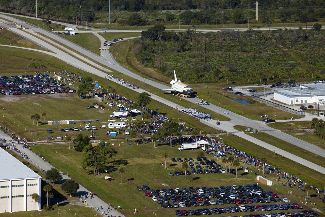 CAPE CANAVERAL, Fla. – Space shuttle Atlantis is transported along NASA Causeway at NASA's Kennedy Space Center in Florida on its 10-mile journey to the Kennedy Space Center Visitor Complex where it will be put on public display. As part of transition and retirement of the Space Shuttle Program, Atlantis is to be displayed at Kennedy's Visitor Complex beginning in the summer of 2013. Over the course of its 26-year career, Atlantis traveled 125,935,769 miles during 307 days in space over 33 missions. For more information, visit http:__www.nasa.gov_transition Photo credit: NASA_ Kim Shiflett