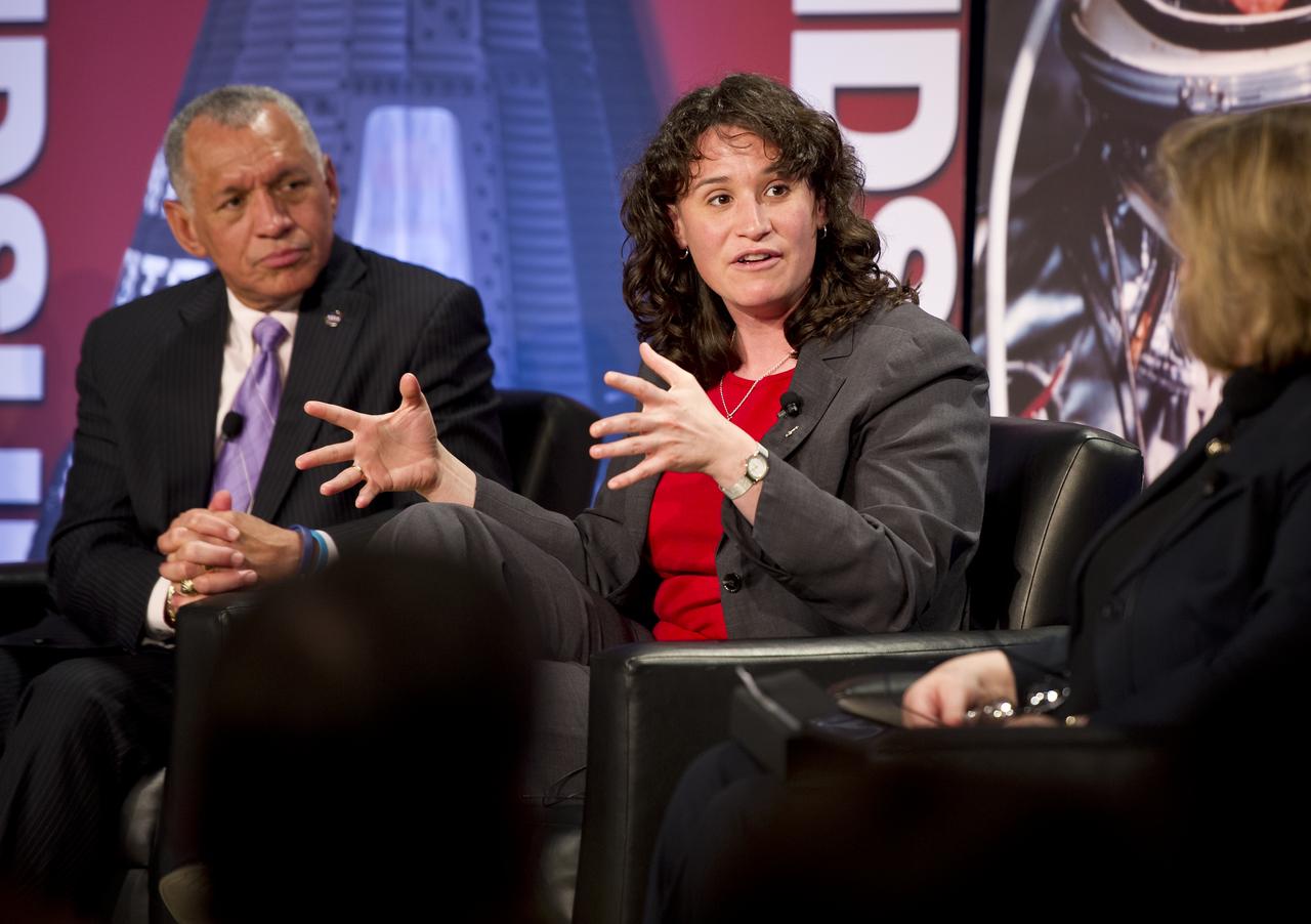 NASA 2009 Astronaut Candidate and Flight Surgeon Serena Auñón talks as NASA Administrator Charles Bolden looks on during a NASA Future Forum panel discussion at The Ohio State University on Monday, Feb. 20, 2012, in Columbus, Ohio.  Monday marked the 50th anniversary of Glenn's historic flight as the first American to orbit Earth.  Photo Credit: (NASA/Bill Ingalls)