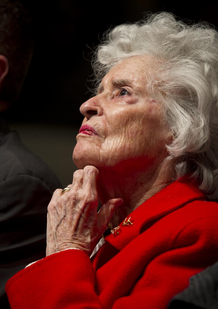 Wife of former astronaut and Senator John Glenn, Annie Glenn, listens intently to Cleveland State University Master of Music Major James Binion Jr. as he sings a musical tribute during an event celebrating John Glenn's legacy and 50 years of americans in orbit held at the university's Wolstein Center on Friday, March 3, 2012 in Cleveland, Ohio.  Glenn became the first American to orbit Earth in 1962.  Photo Credit: (NASA/Bill Ingalls)