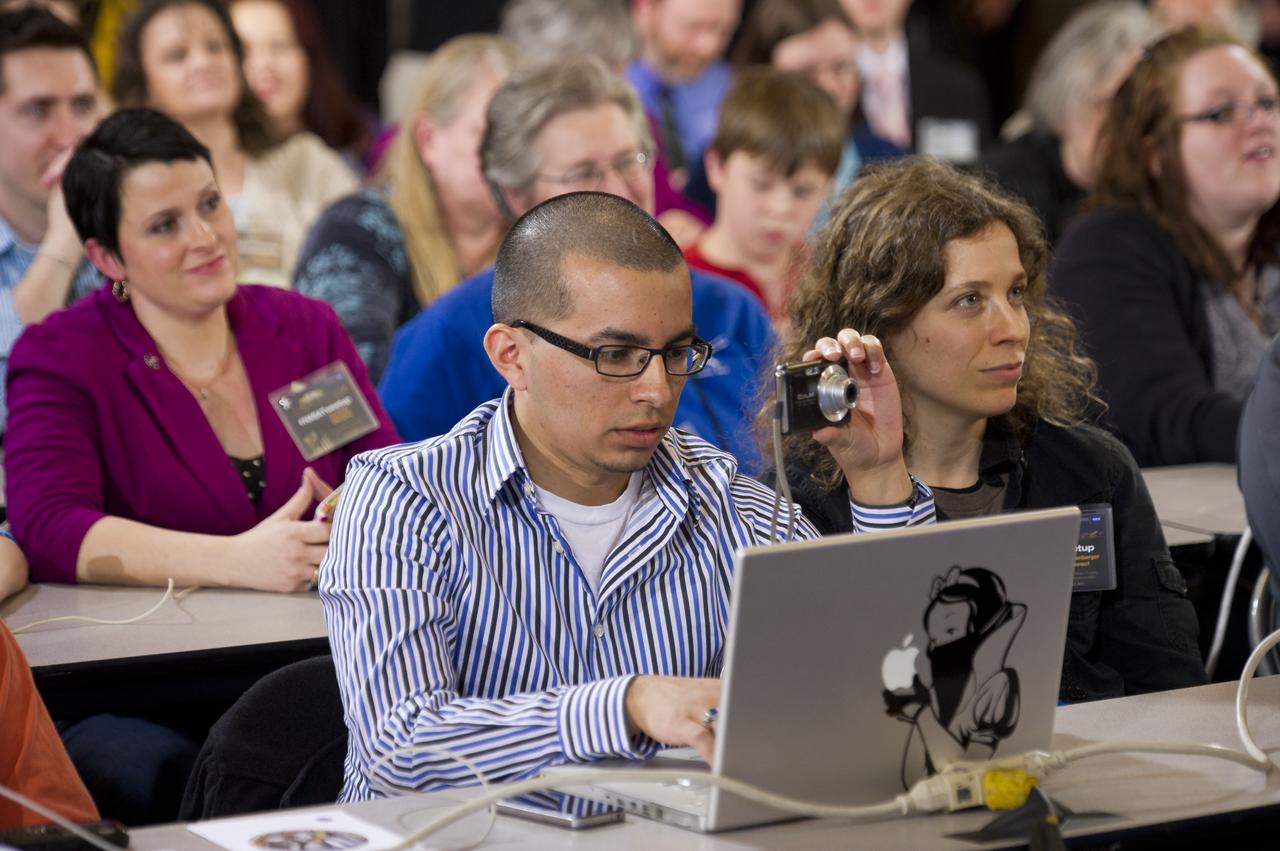 A NASA Tweetup attendee captures images of Sen. John Glenn at an event celebrating John Glenn's legacy and 50 years of americans in orbit held at the Cleveland State University Wolstein Center on Friday, March 3, 2012 in Cleveland, Ohio. Glenn became the first American to orbit Earth in 1962.  Photo Credit: (NASA/Bill Ingalls)