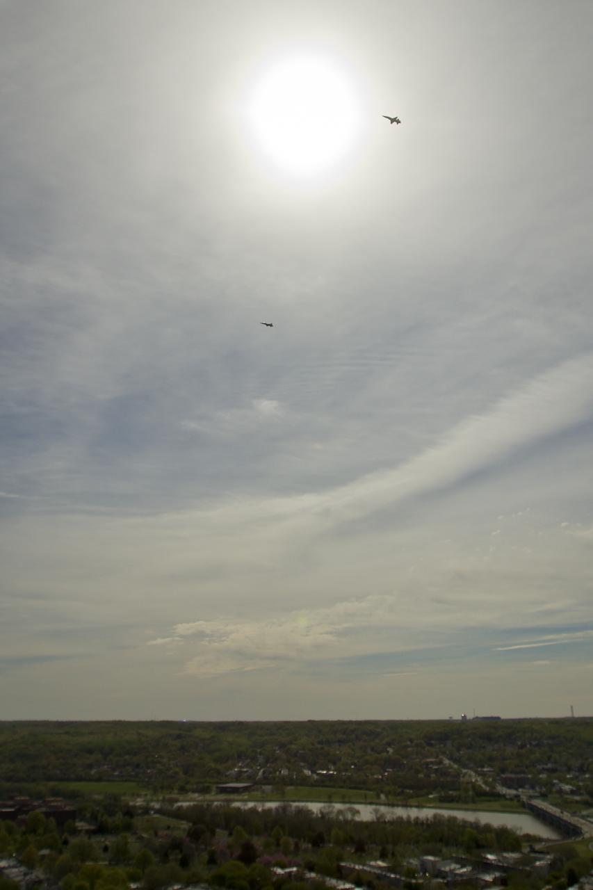 Two NASA T-38 training jets are seen as they fly over Washington, DC, Thursday, April 5, 2012. NASA, in cooperation with the Federal Aviation Administration, conducted training and photographic flights over the DC metropolitan area. T-38 aircraft have been used for astronaut training for more than 30 years as they allow pilots and mission specialists to think quickly in changing situations, mental experiences the astronauts say are critical to practicing for the rigors of spaceflight. Photo Credit: (NASA/Bill Ingalls)