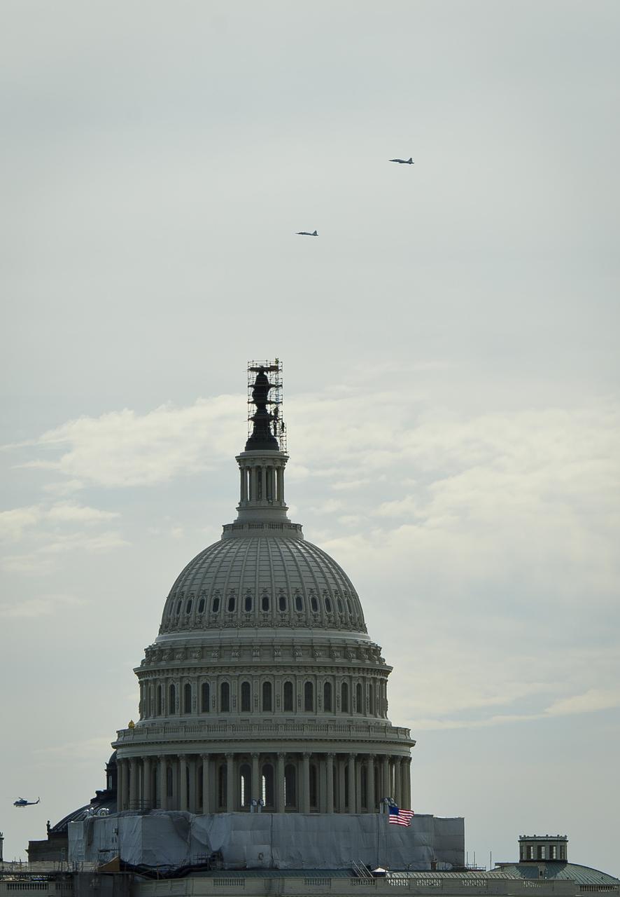 Two NASA T-38 training jets are seen as they fly over the U.S. Capitol, Thursday, April 5, 2012, in Washington.  NASA, in cooperation with the Federal Aviation Administration, conducted training and photographic flights over the DC metropolitan area.  T-38 aircraft have been used for astronaut training for more than 30 years as they allow pilots and mission specialists to think quickly in changing situations, mental experiences the astronauts say are critical to practicing for the rigors of spaceflight.  Photo Credit: (NASA/Paul E. Alers)