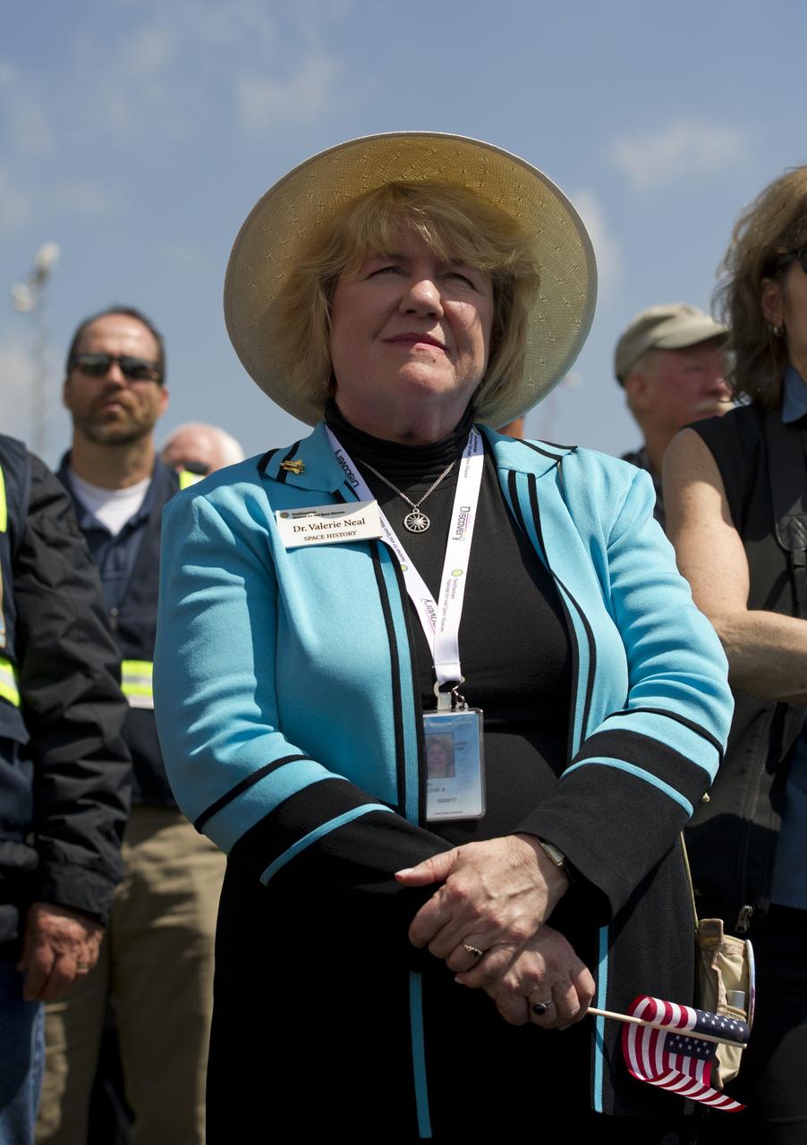 Dr. Valerie Neal, curator for the shuttle program in the Space History office at the National Air and Space Museum, attends the transfer ceremony for space shuttle Discovery, Thursday, April 19, 2012, at the Smithsonian's Steven F. Udvar-Hazy Center in Chantilly, Va.  Discovery, the first orbiter retired from NASA’s shuttle fleet, which completed 39 missions, spent 365 days in space, orbited the Earth 5,830 times, and traveled 148,221,675 miles will take the place of Enterprise at the center to commemorate past achievements in space and to educate and inspire future generations of explorers at the center. Photo Credit: (NASA/Carla Cioffi)