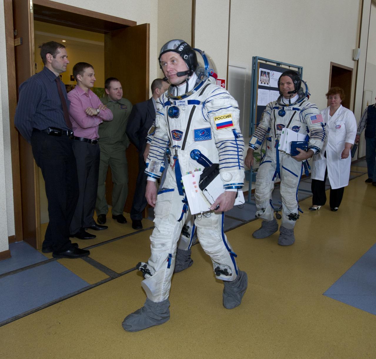 Expedition 31 backup crew member Oleg Novitskiy, foreground, and Kevin Ford head towards a Soyuz spacecraft mockup to conduct final simulation tests in preparation for flight, Monday, April 23, 2012 at the Gagarin Cosmonaut Training Center in Star City, Russia.  Photo Credit:  (NASA/Carla Cioffi)