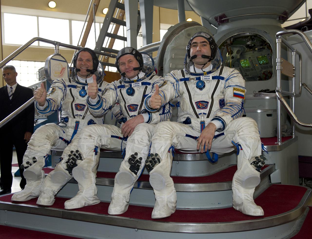 Expedition 31 backup crew members Kevin Ford (left), Oleg Novitskiy and Evgeny Tarelkin (right) give the thumbs up before their final qualification test in preparation for flight, Monday, April 23, 2012 at the Gagarin Cosmonaut Training Center in Star City, Russia.   Expedition 31 prime crew members commander Gennady Padalka, flight engineers Joe Acaba and Sergei Revin practiced similar scenarios nearby in advance of their final approval for launch to the International Space Station, scheduled for May 15, 2012.  Photo Credit:  (NASA/Carla Cioffi)