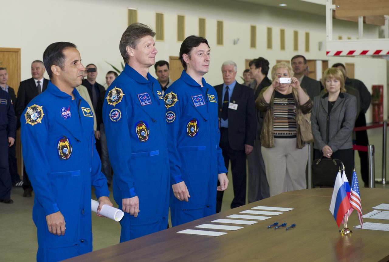 Expedition 31 NASA Flight Engineer Joe Acaba, far left, Expedition 31 Soyuz Commander Gennady Padalka and Flight Engineer Sergei Revin, third from left, select International Space Station Russian segment event simulation test cards for their final qualification test in preparation for launch, Monday, April 23, 2012 at the Gagarin Cosmonaut Training Center in Star City, Russia. Padalka, Acaba and Revin are set to launch May 15 from the Baikonur Cosmodrome in their Soyuz TMA-04M spacecraft to the International Space Station. Photo Credit: (NASA/Carla Cioffi)