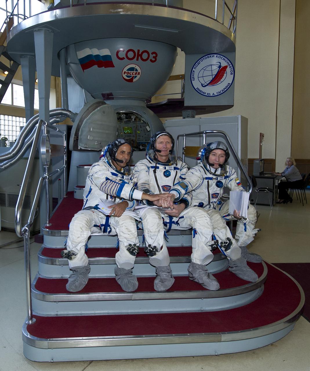Expedition 31 NASA flight engineer Joe Acaba, Soyuz Commander Gennady Padalka and flight engineer Sergei Revin pose for photos before their final qualification test in preparation for flight, Tuesday, April 24, 2012 at the Gagarin Cosmonaut Training Center in Star City, Russia. Acaba, Padalka and Revin are set to launch to the International Space Station May 15 from the Baikonur Cosmodrome in Kazakhstan. Photo Credit: (NASA/Carla Cioffi)