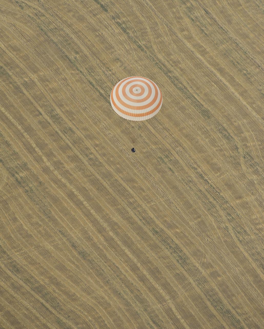 The Soyuz TMA-22 spacecraft is seen as it lands with Expedition 30 Commander Dan Burbank, and Flight Engineers Anton Shkaplerov and Anatoly Ivanishin in a remote area outside of the town of Arkalyk, Kazakhstan, on Friday, April 27, 2012. NASA Astronaut Burbank, Russian Cosmonauts Shkaplerov and Ivanishin are returning from more than five months onboard the International Space Station where they served as members of the Expedition 29 and 30 crews. Photo Credit: (NASA/Carla Cioffi)