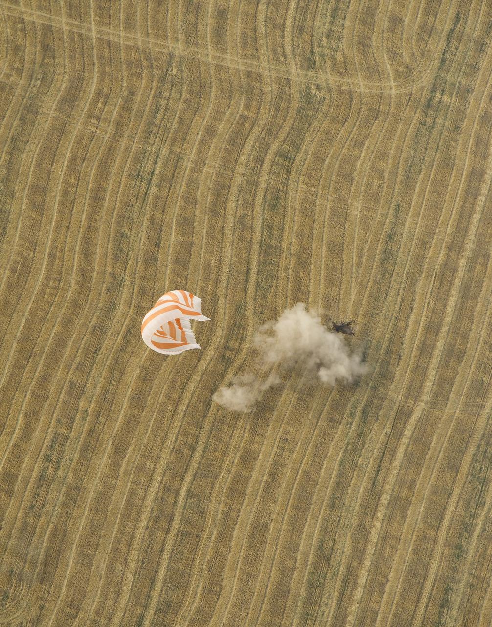 The Soyuz TMA-22 spacecraft is seen as it lands with Expedition 30 Commander Dan Burbank, and Flight Engineers Anton Shkaplerov and Anatoly Ivanishin in a remote area outside of the town of Arkalyk, Kazakhstan, on Friday, April 27, 2012. NASA Astronaut Burbank, Russian Cosmonauts Shkaplerov and Ivanishin are returning from more than five months onboard the International Space Station where they served as members of the Expedition 29 and 30 crews.  Photo Credit: (NASA/Carla Cioffi)