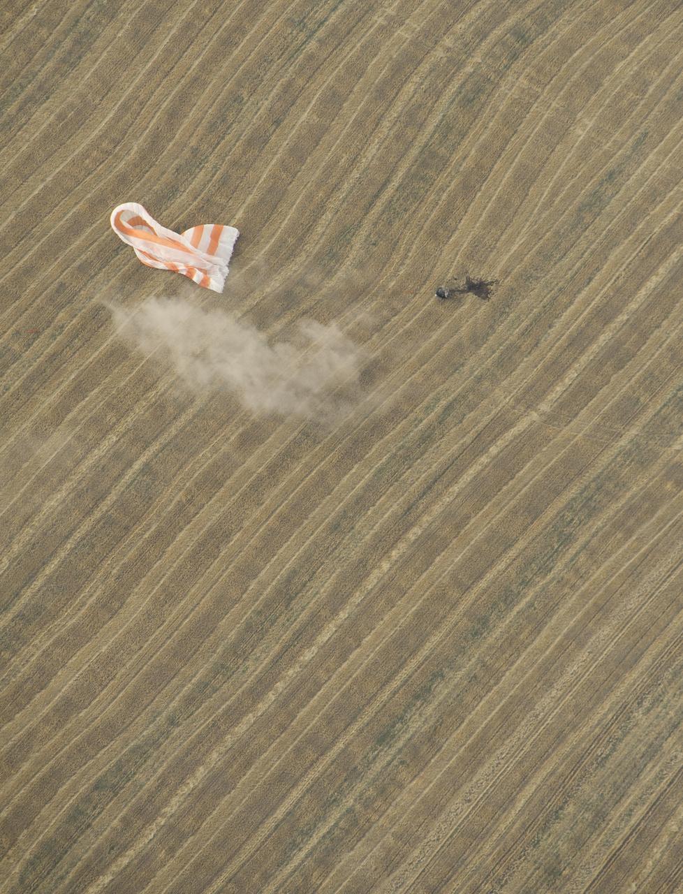 The Soyuz TMA-22 spacecraft is seen as it lands with Expedition 30 Commander Dan Burbank, and Flight Engineers Anton Shkaplerov and Anatoly Ivanishin in a remote area outside of the town of Arkalyk, Kazakhstan, on Friday, April 27, 2012. NASA Astronaut Burbank, Russian Cosmonauts Shkaplerov and Ivanishin are returning from more than five months onboard the International Space Station where they served as members of the Expedition 29 and 30 crews. Photo Credit: (NASA/Carla Cioffi)