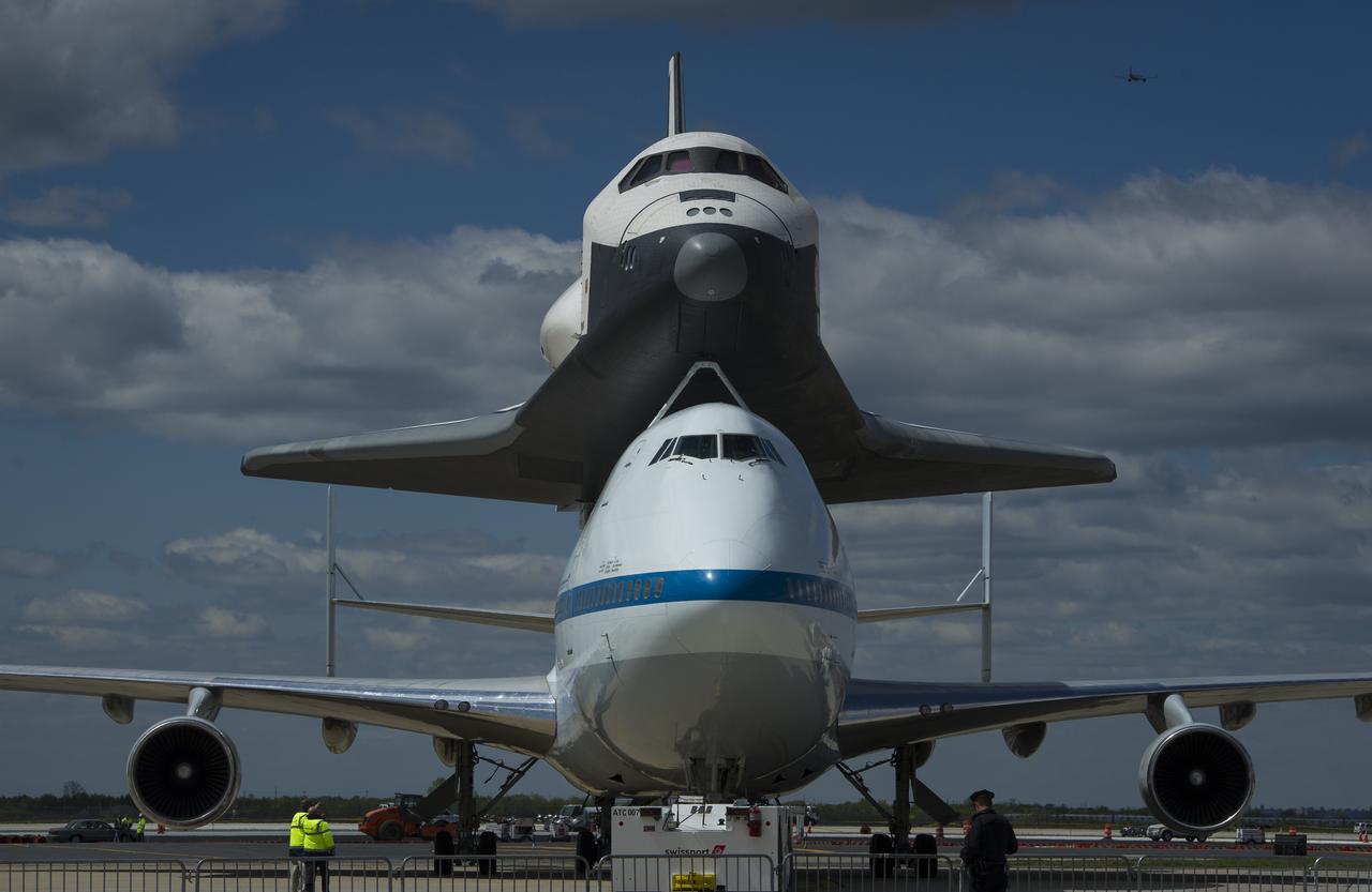 Space shuttle Enterprise, mounted atop a NASA 747 Shuttle Carrier Aircraft (SCA), is seen as it taxis at John F. Kennedy Airport, Friday, April 27, 2012, in New York. Enterprise was the first shuttle orbiter built for NASA performing test flights in the atmosphere and was incapable of spaceflight. Originally housed at the Smithsonian's Steven F. Udvar-Hazy Center, Enterprise will be demated from the SCA and placed on a barge that will eventually be moved by tugboat up the Hudson River to the Intrepid Sea, Air & Space Museum in June. Photo Credit: (NASA/Paul E. Alers)