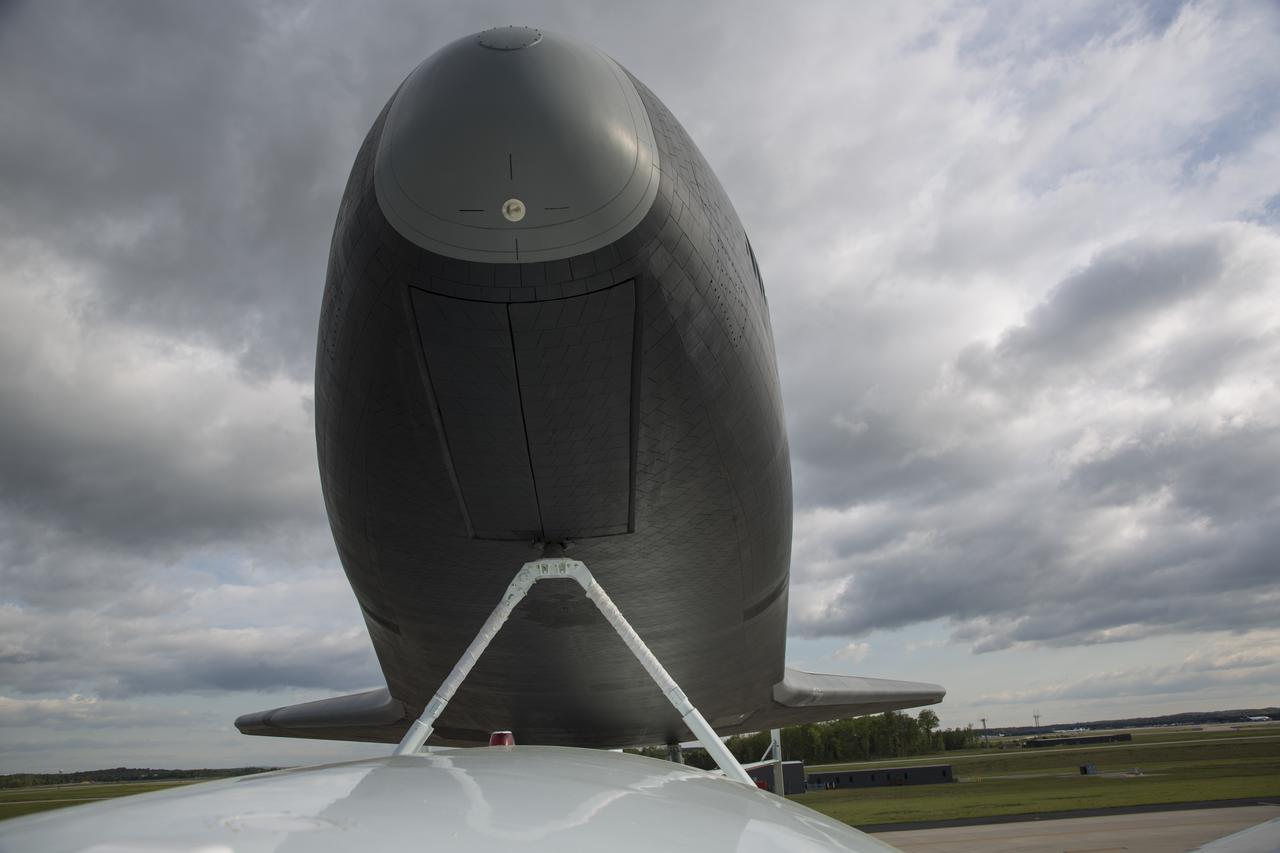 Space shuttle Enterprise, mounted atop a NASA 747 Shuttle Carrier Aircraft (SCA), is seen prior to taking off for New York from Washington Dulles International Airport, Friday, April 27, 2012, in Sterling, VA. Enterprise was the first shuttle orbiter built for NASA performing test flights in the atmosphere and was incapable of spaceflight. Originally housed at the Smithsonian's Steven F. Udvar-Hazy Center, Enterprise will be demated from the SCA and placed on a barge that will eventually be moved by tugboat up the Hudson River to the Intrepid Sea, Air & Space Museum in June. Photo Credit: (NASA/Scott Andrews)