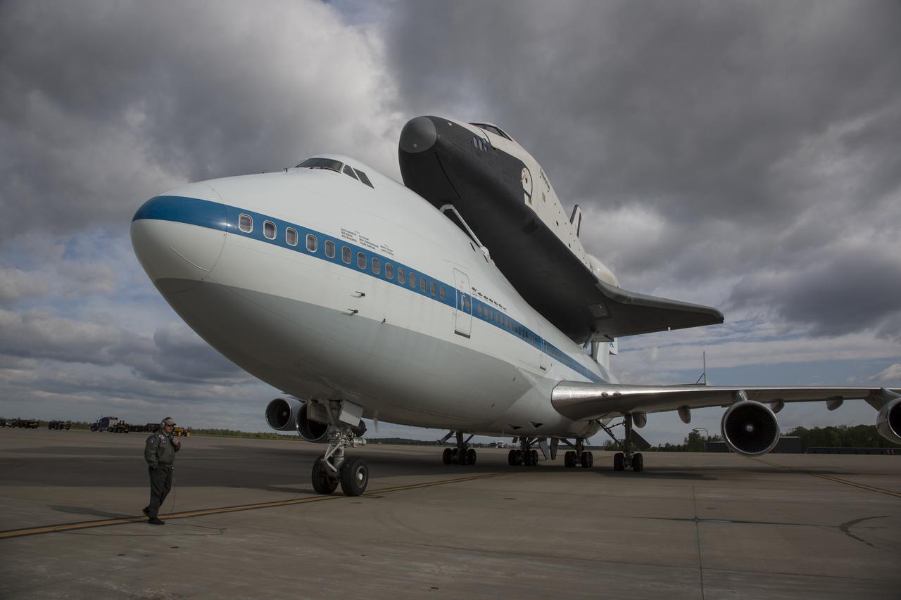 Space shuttle Enterprise, mounted atop a NASA 747 Shuttle Carrier Aircraft (SCA), is seen prior to taking off for New York from Washington Dulles International Airport, Friday, April 27, 2012, in Sterling, VA. Enterprise was the first shuttle orbiter built for NASA performing test flights in the atmosphere and was incapable of spaceflight. Originally housed at the Smithsonian's Steven F. Udvar-Hazy Center, Enterprise will be demated from the SCA and placed on a barge that will eventually be moved by tugboat up the Hudson River to the Intrepid Sea, Air & Space Museum in June. Photo Credit: (NASA/Scott Andrews)