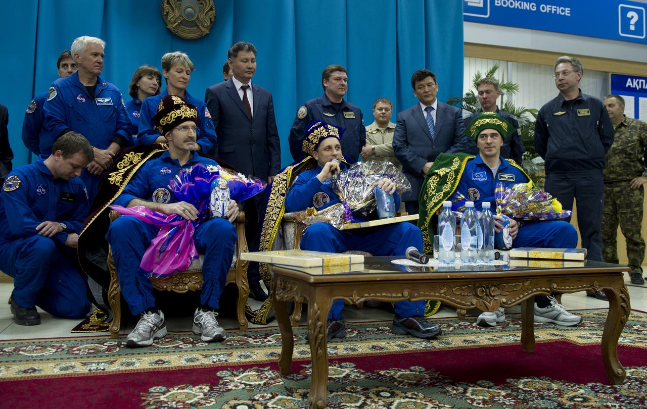 Seated from left, Expedition 30 Commander Daniel Burbank, Flight Engineers Anton Shkaplerov, and Anatoly Ivanishin are seen during a welcome ceremony and press conference at the Kostanay Airport in Kazakhstan on Friday, April 27, 2012. NASA Astronaut Burbank, and Russian Cosmonauts Anton Shkaplerov and Anatoly Ivanishin returned from more than five months onboard the International Space Station where they served as members of the Expedition 29 and 30 crews. Photo Credit: (NASA/Carla Cioffi)