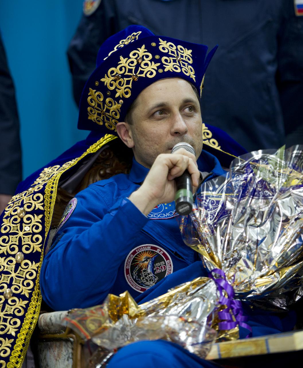 Expedition 30 Flight Engineer Anton Shkaplerov is seen in a gift of traditional Kazakhstan dress during a welcome ceremony at the Kostanay Airport in Kazakhstan on Friday, April 27, 2012.  NASA Astronaut Burbank, and Russian Cosmonauts Anton Shkaplerov and Anatoly Ivanishin returned from more than five months onboard the International Space Station where they served as members of the Expedition 29 and 30 crews. Photo Credit: (NASA/Carla Cioffi)